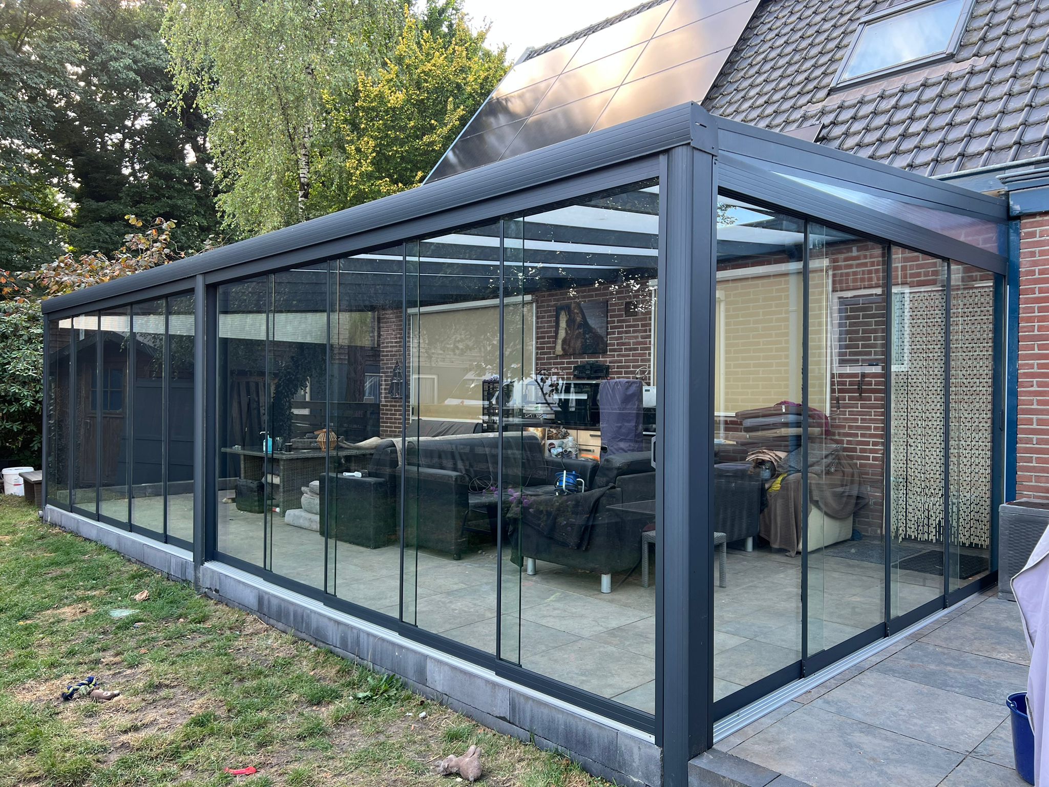 Glazen schuifwand rondom veranda
